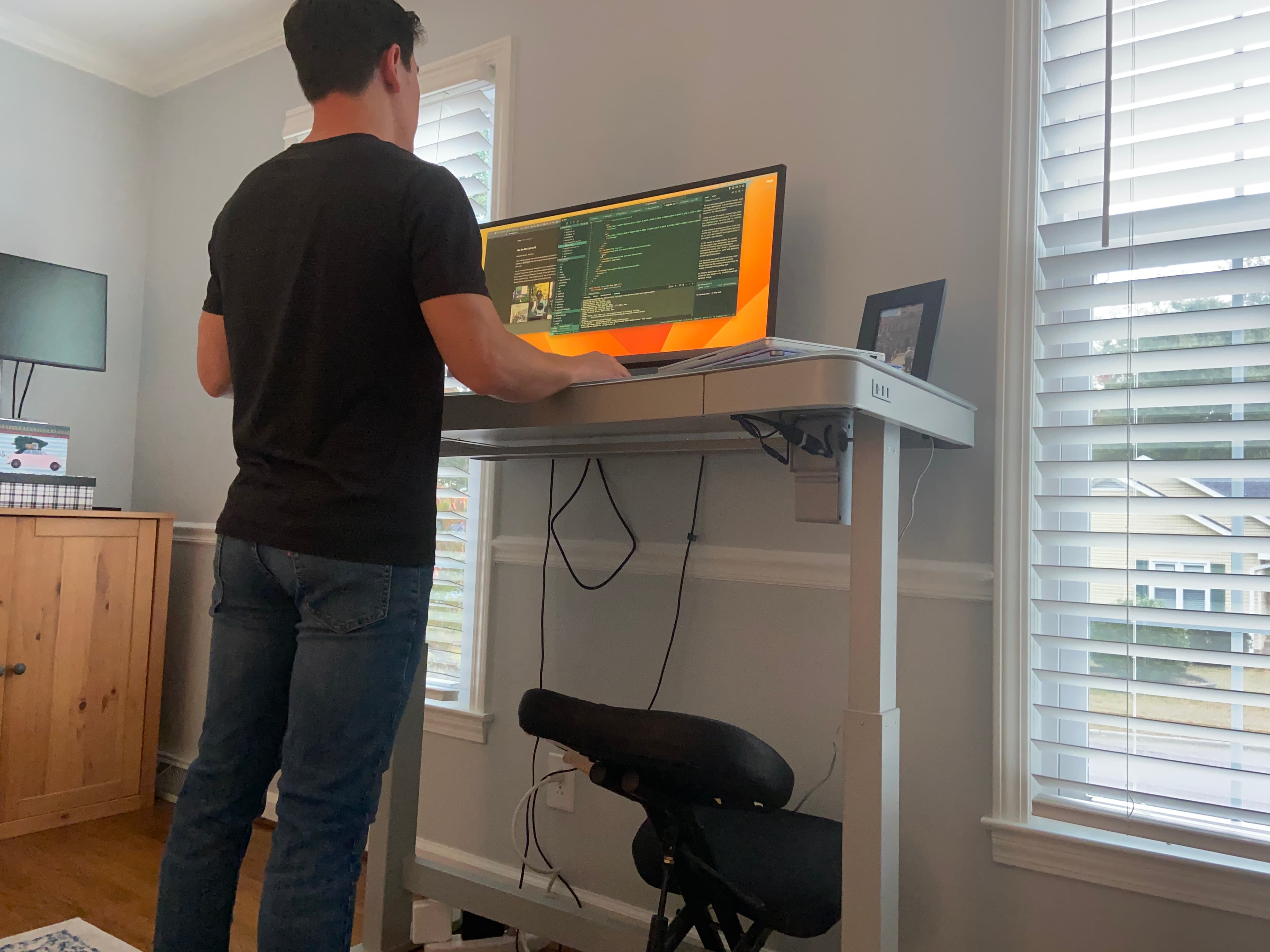 Focus mode of myself standing at my desk coding.